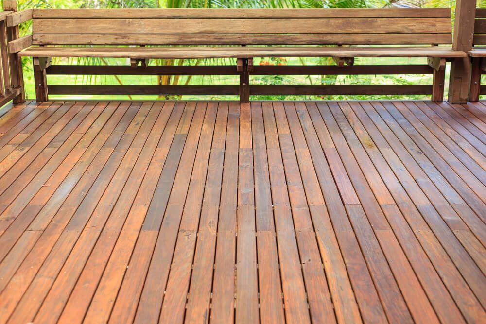 A Wooden Deck with A Bench in The Background — Lismore Floor Sanding in Mullumbimby, NSW