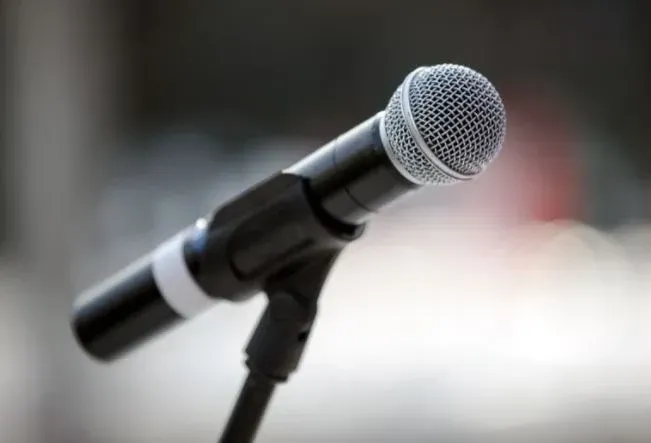 Microphone on a stand against a blurred background