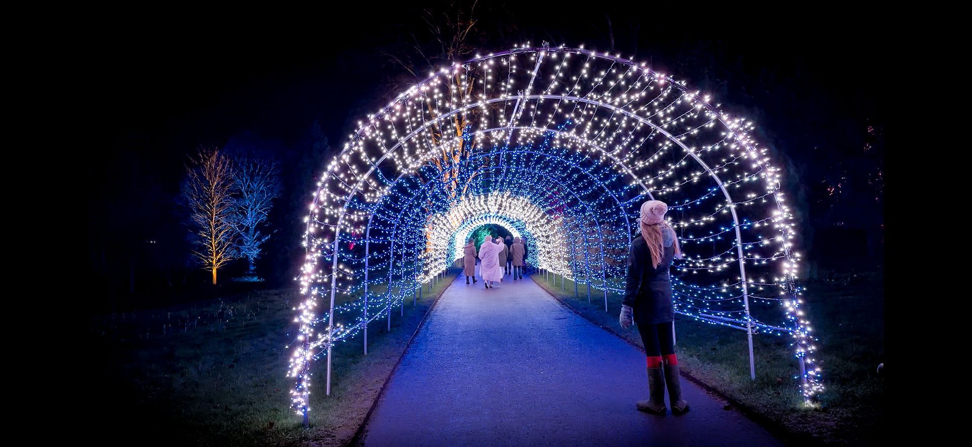 Pixel LED fairy light tunnel with running lights creating immersive walk-through experience.