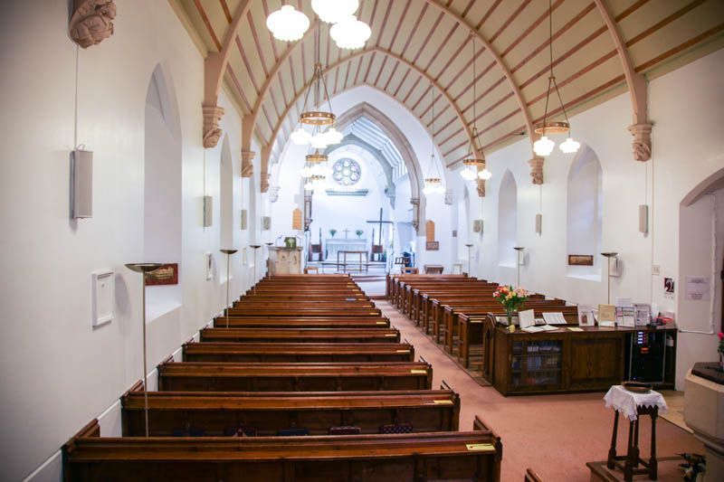 Photo of a church with new speakers installed on the walls