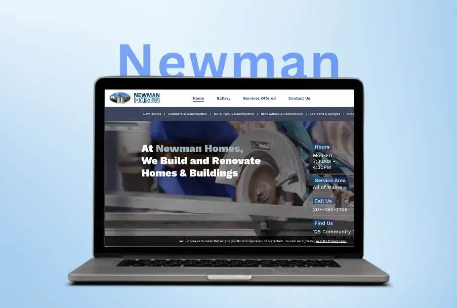 A laptop computer is open to a website for newman homes.