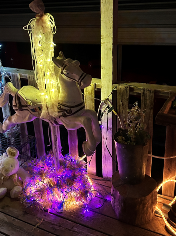 Easter greetings; happy; spring flowers; carousel horse decorated with Easter decos