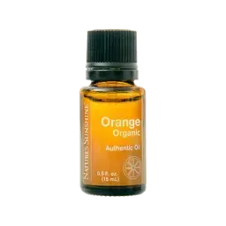 small orange bottle of oil with black lid