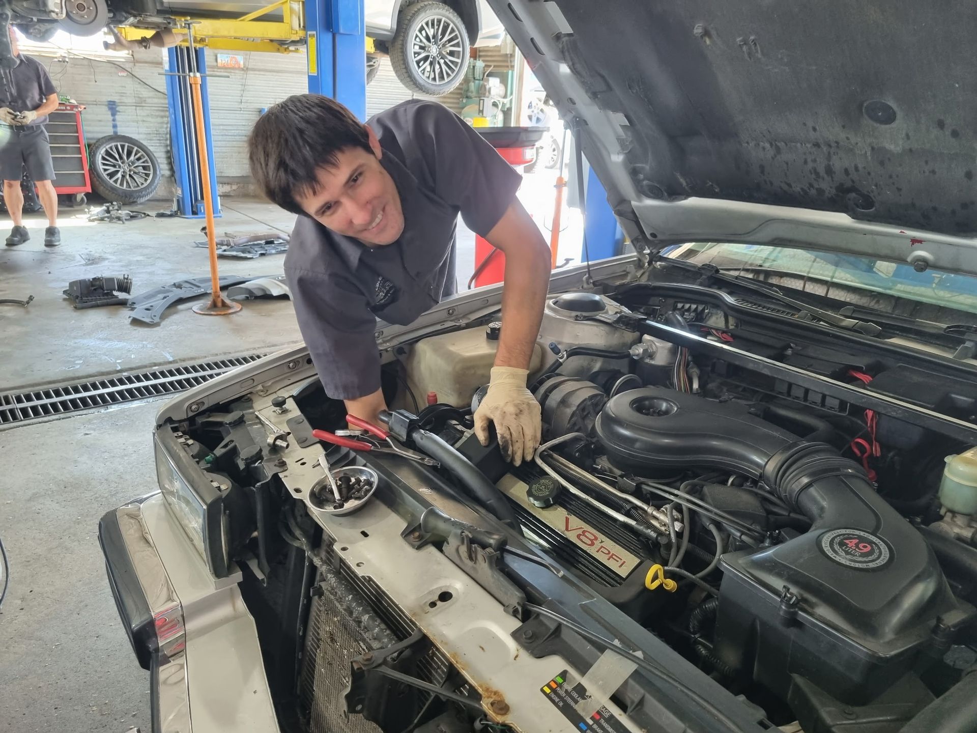 Brandon Working On Cadillac | Cole's Auto Repair & Service
