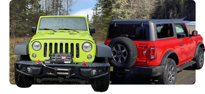 Two Jeep Wranglers in snow, one neon green front view and one red rear view, parked side by side.