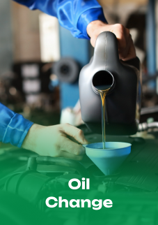 A person is pouring oil into a funnel. | Emerald Automotive