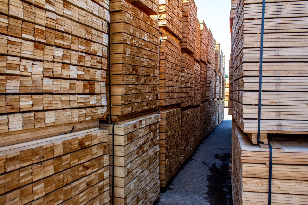Stacks of Lumber in A Lumberyard, Varying Shades of Brown — DGW Wholesale Timber & Hardware in Heddon Greta, NSW
