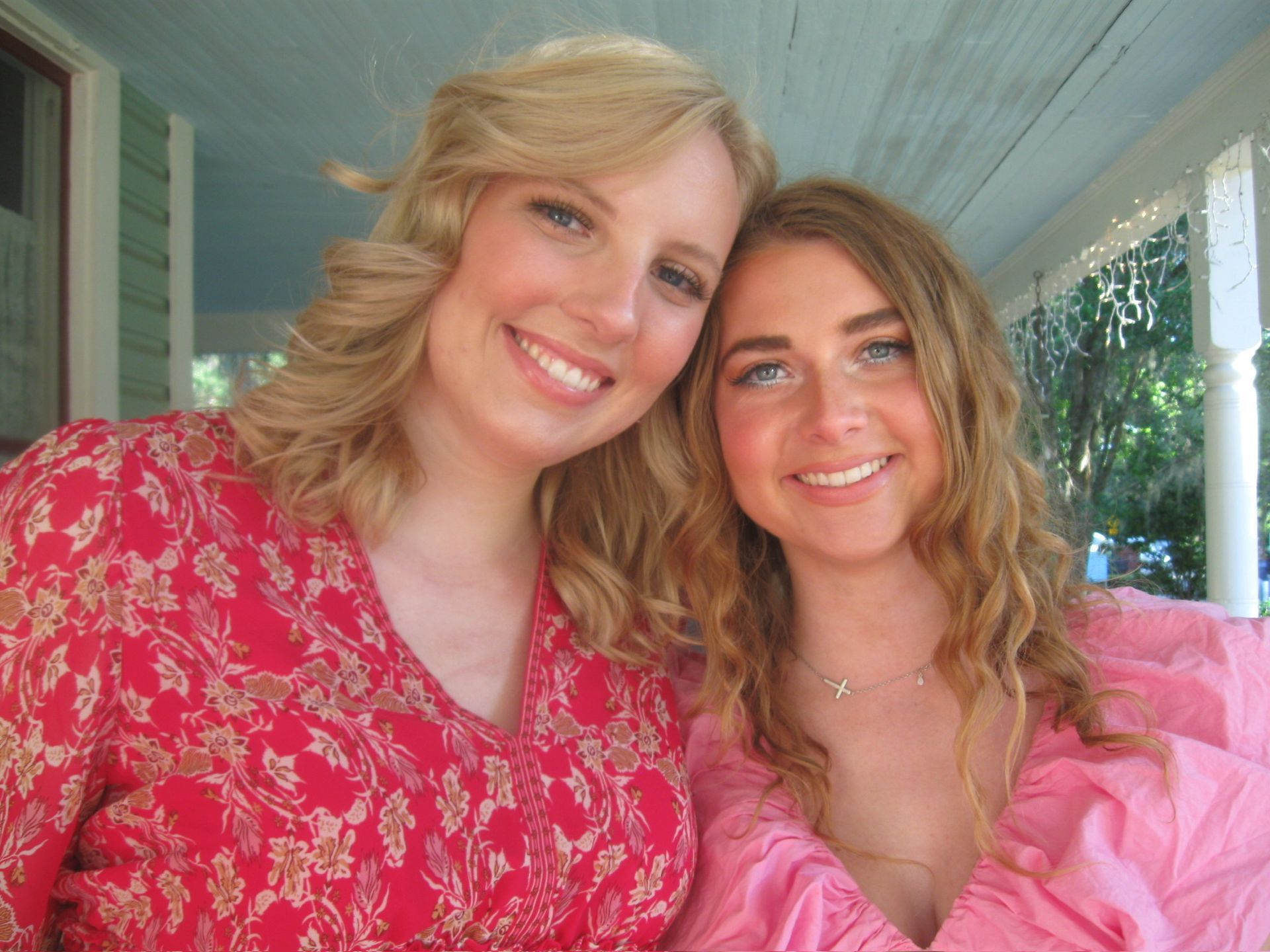 women smiling at the camera 