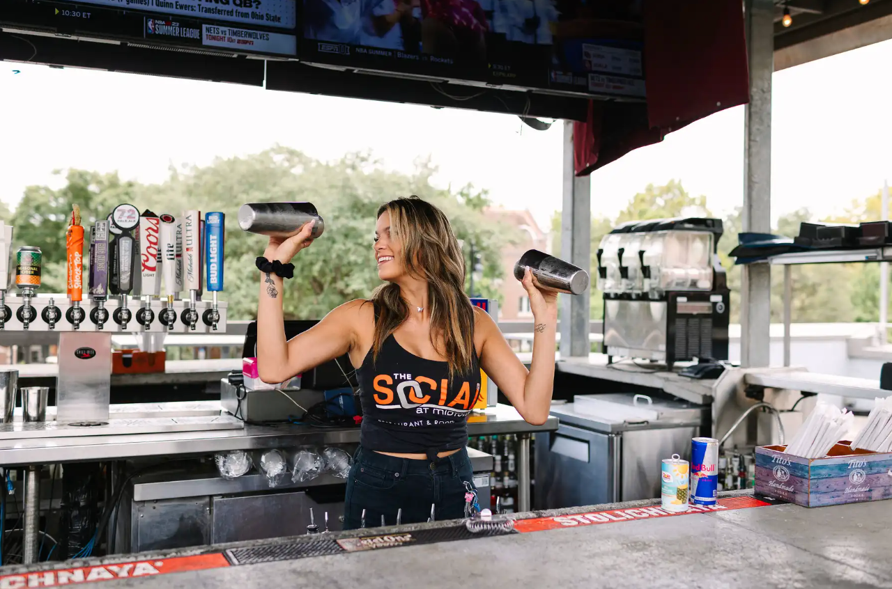 Bartender at The Social at Midtown shaking drinking