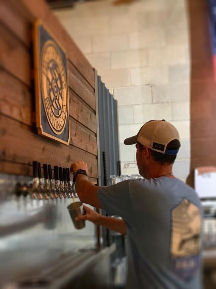 owner of high springs brewing co pouring beer