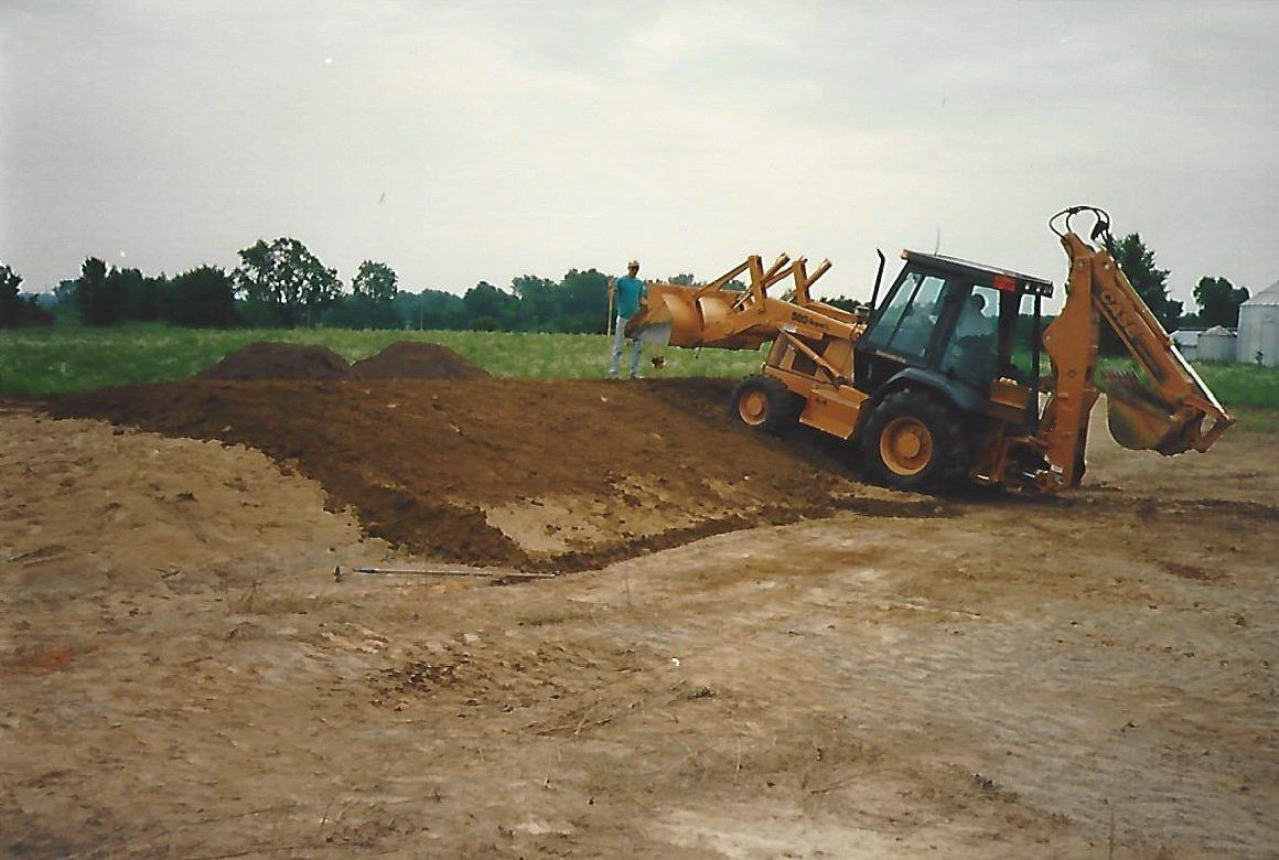 Workers Working on the Ground — Plymouth, IN — Creed Septic System Specialist
