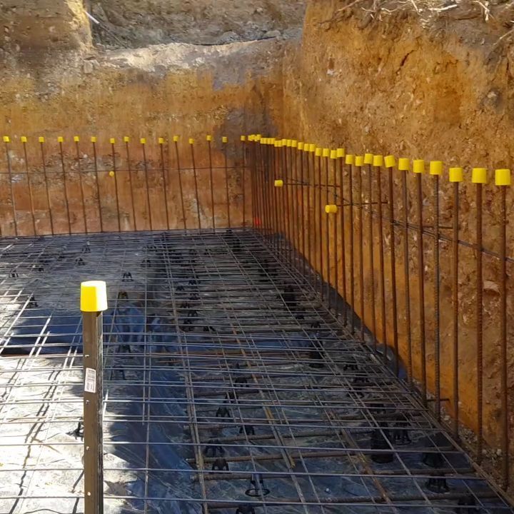 A Construction Site With a Yellow Pole in the Middle — TJ Concreting in Northern Rivers, NSW