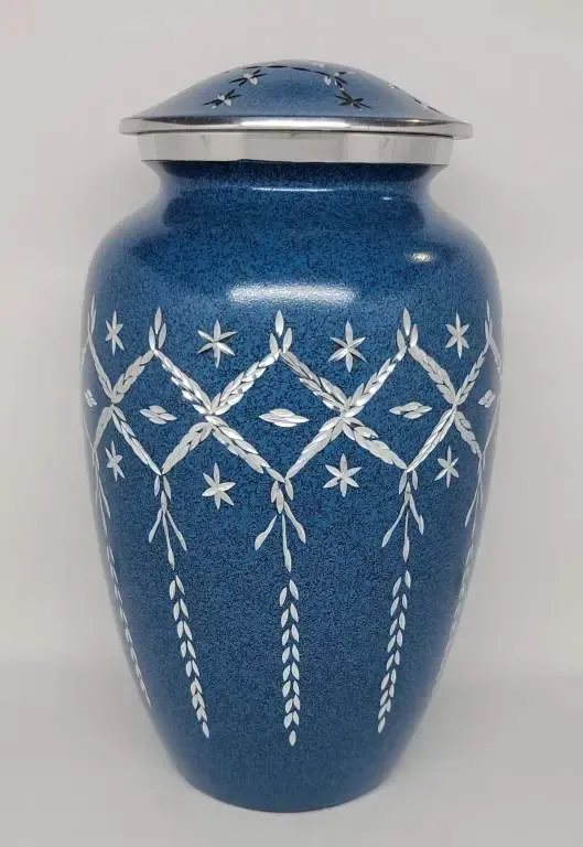 A blue vase with white flowers on it