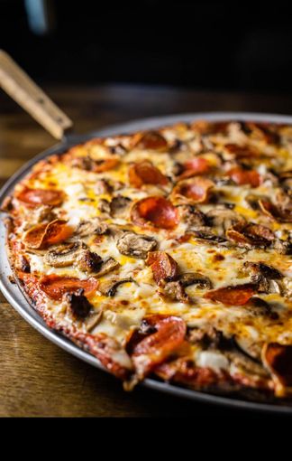 Various pizzas on trays