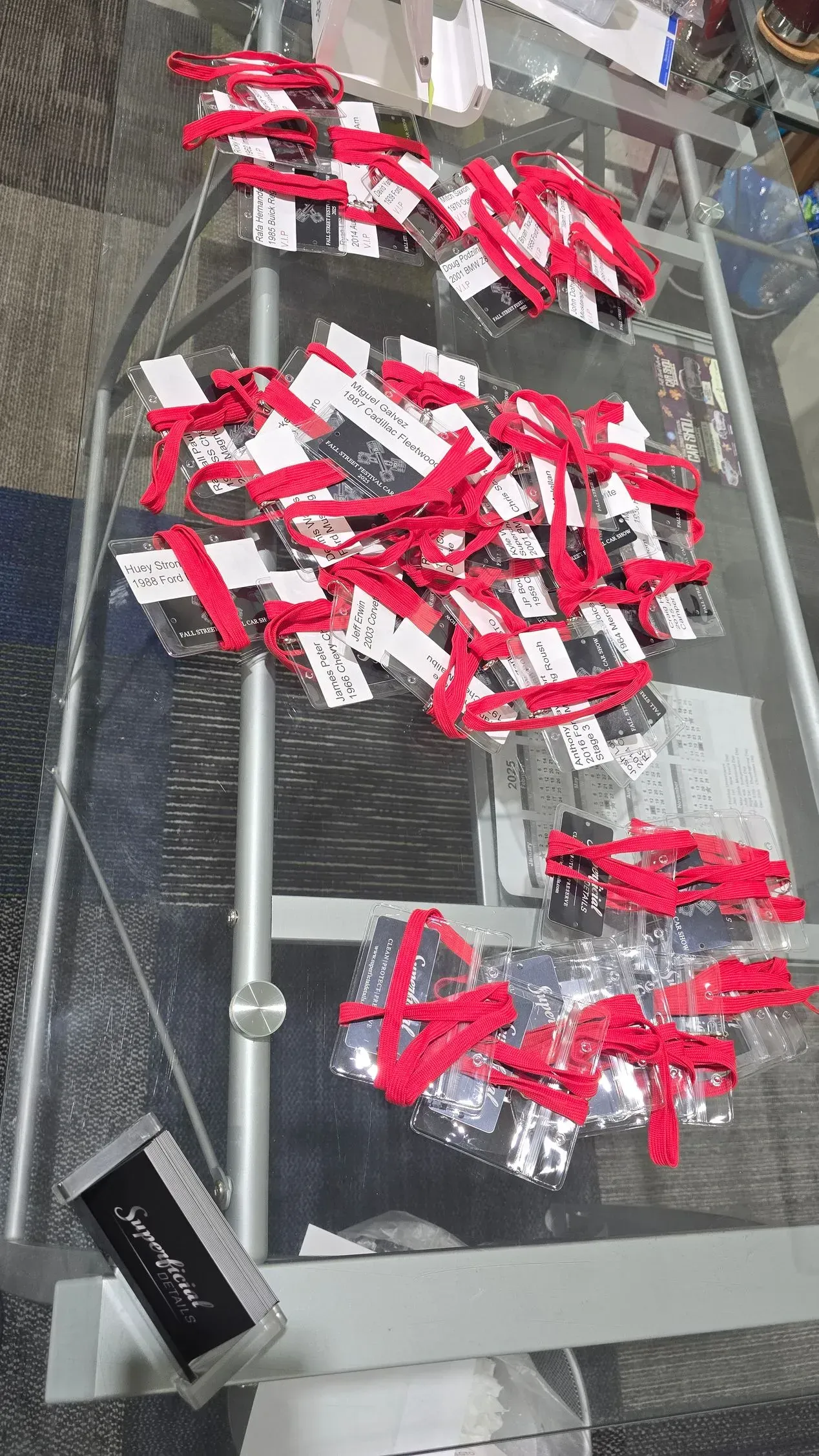 Red-and-white packaged items scattered on metal conveyor belts in an industrial setting