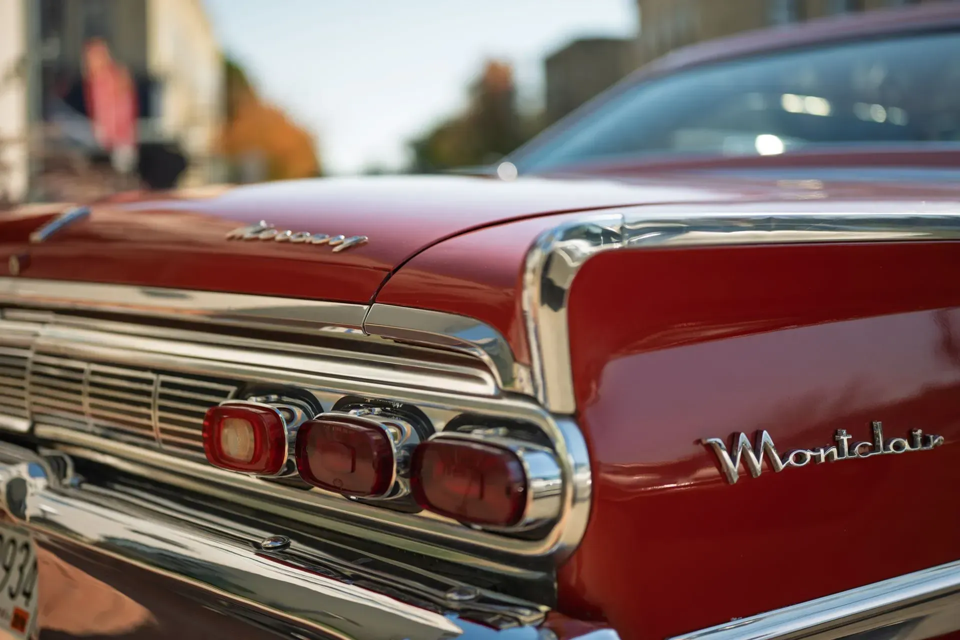 Close-up of a red classic Chevrolet Monte Carlo rear with chrome trim and taillights