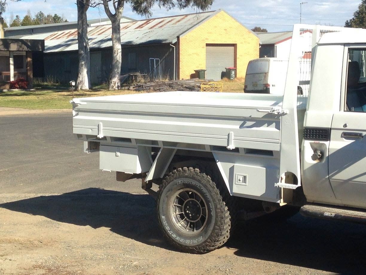 A White Truck With UTE Is Parked On The Side Of The Road — ASSB Armidale Sand And Soda Blasting In  Armidale, NSW