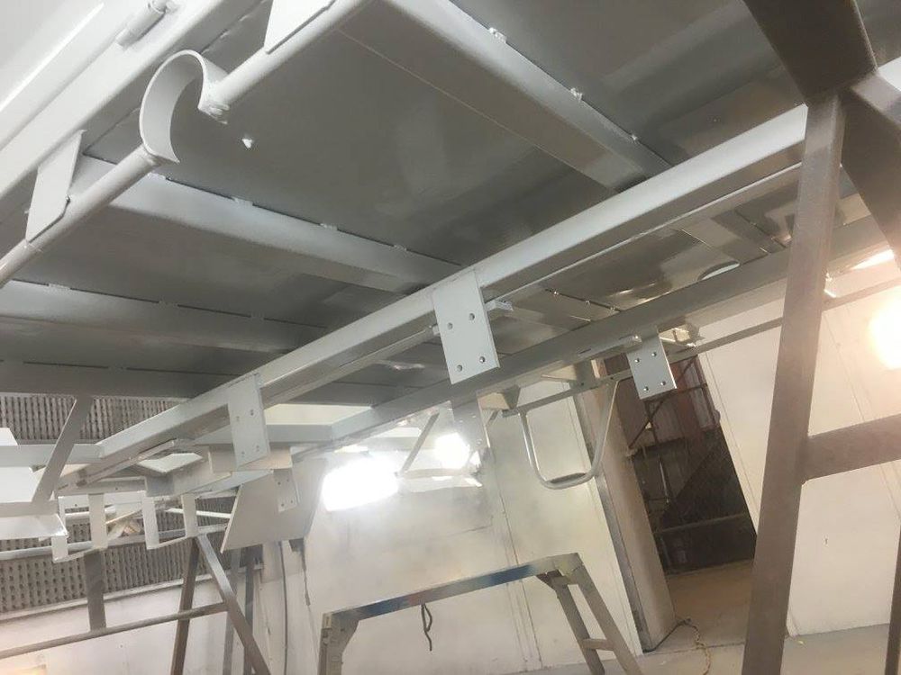 A Metal Structure Is Being Painted in A Powder Coating Shop — ASSB Armidale Sand And Soda Blasting In Guyra, NSW