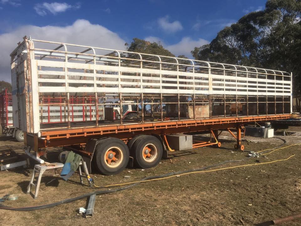 A Large Trailer Is Sitting in The Middle of A Field — ASSB Armidale Sand And Soda Blasting In  Armidale, NSW