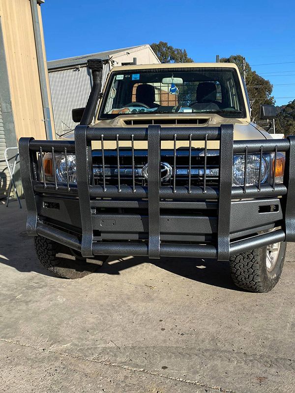 A Truck with A Black Bumper Is Parked on The Side of The Road — ASSB Armidale Sand And Soda Blasting In Armidale, NSW