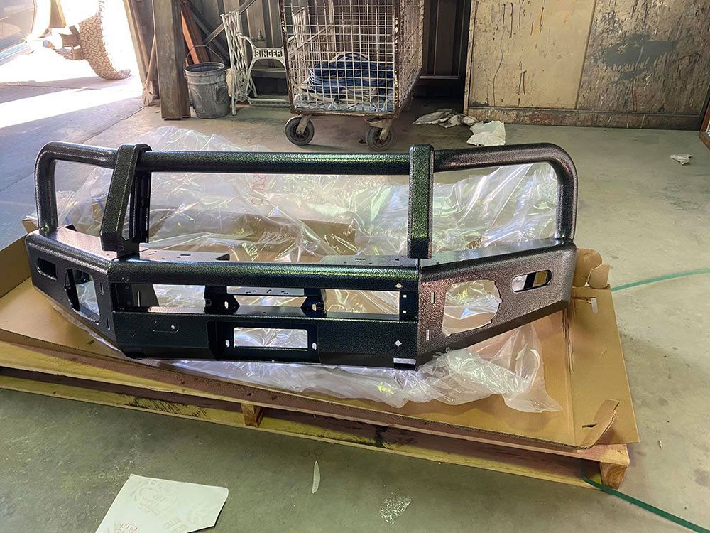 A Front Metal Truck Bumper With Black Colour Paint — ASSB Armidale Sand And Soda Blasting In Glen Innes, NSW