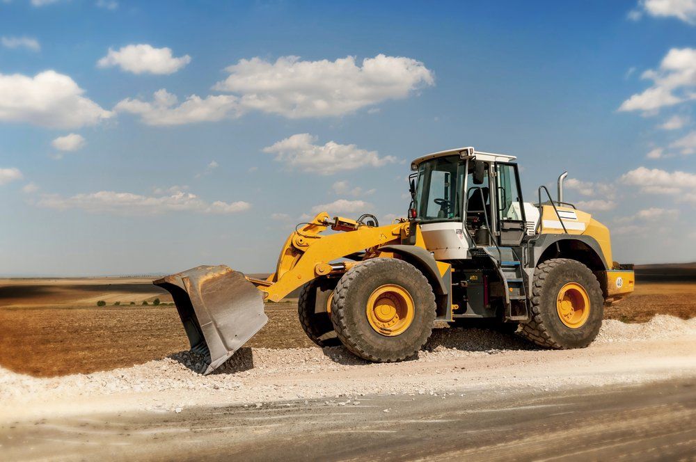 Large Yellow Bulldozer — Whitsunday Drainage Contractors in Airlie Beach, QLD