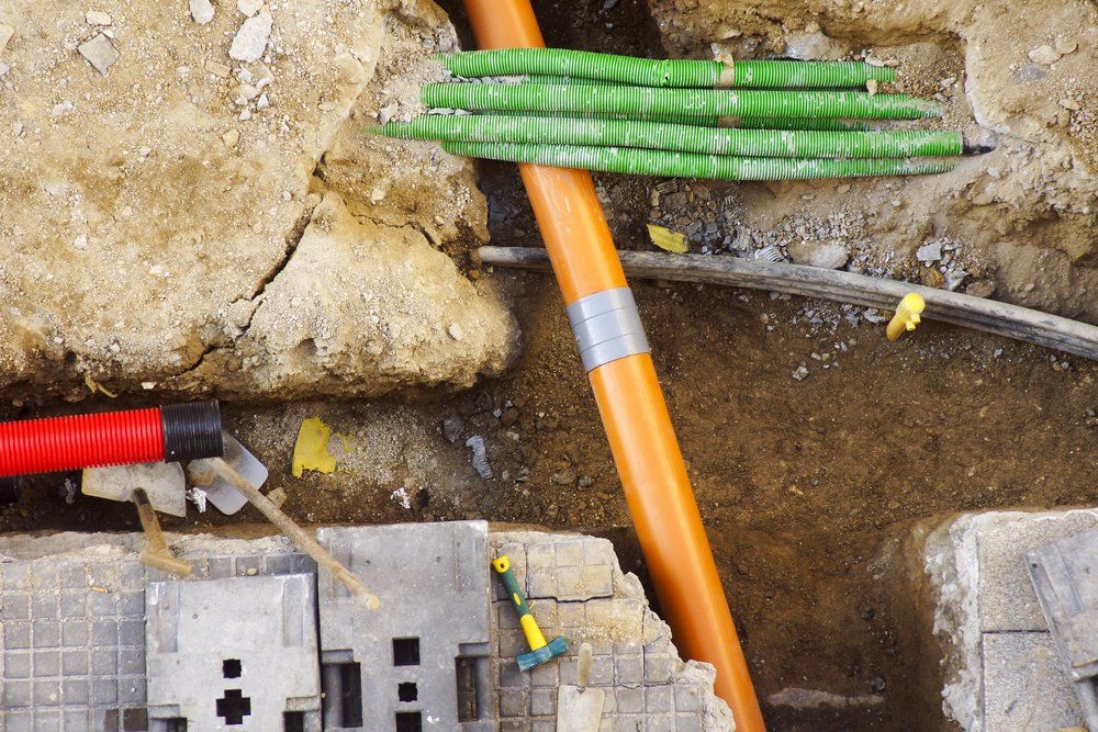 Trench Showing Various Piping — Whitsunday Drainage Contractors in Bowen, QLD