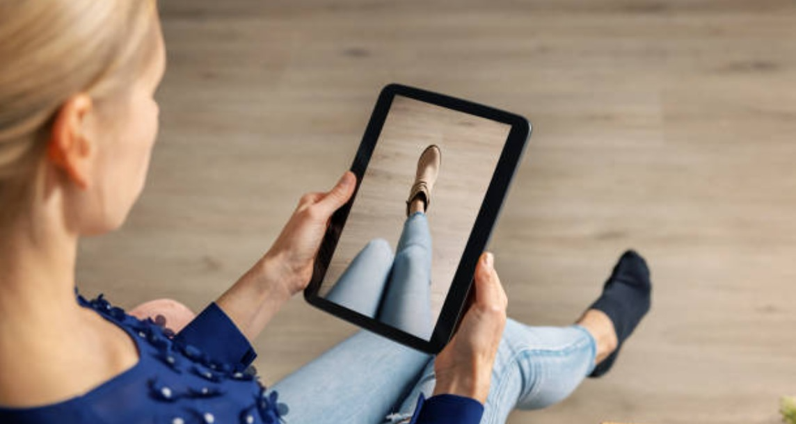 woman trying on a shoe using AR filter for fashion