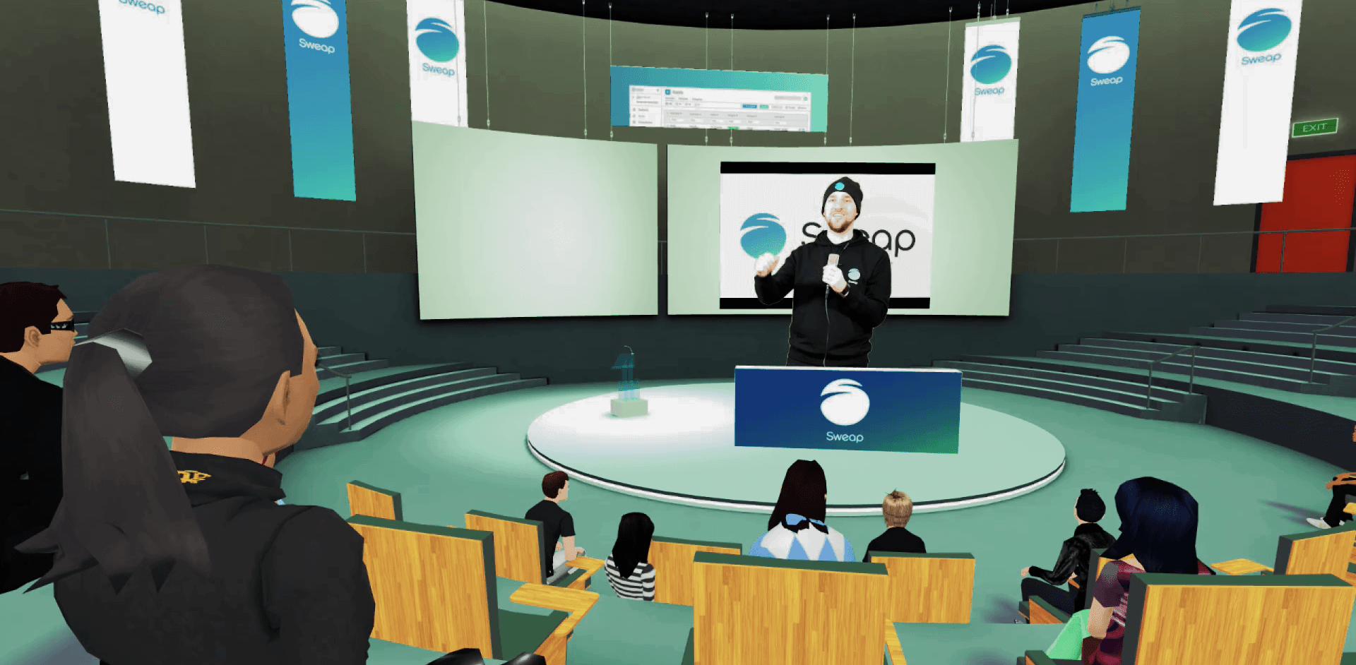 A man is giving a presentation to a group of people in a metaverse auditorium.