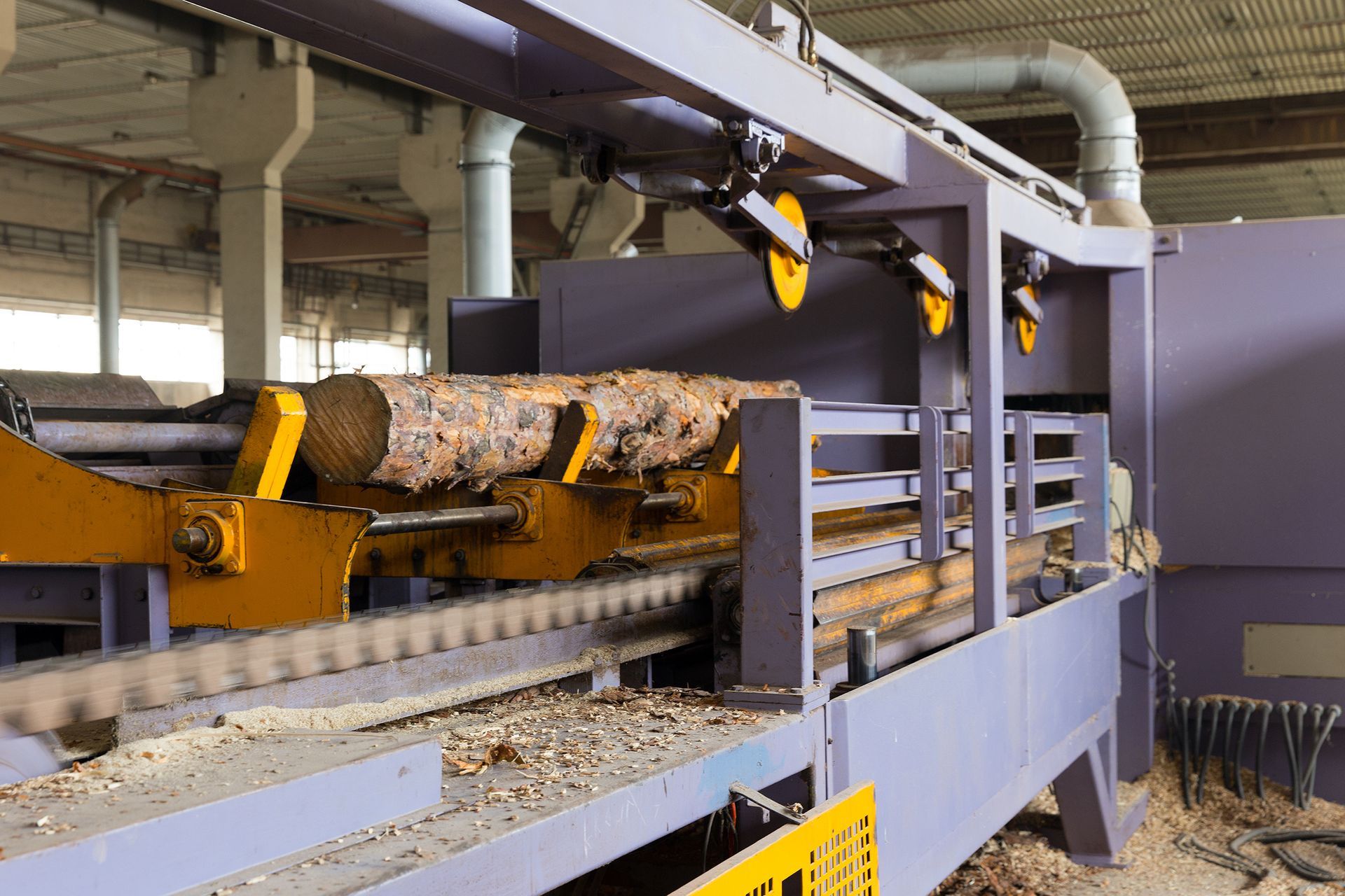 View of a sawmill processing a log.