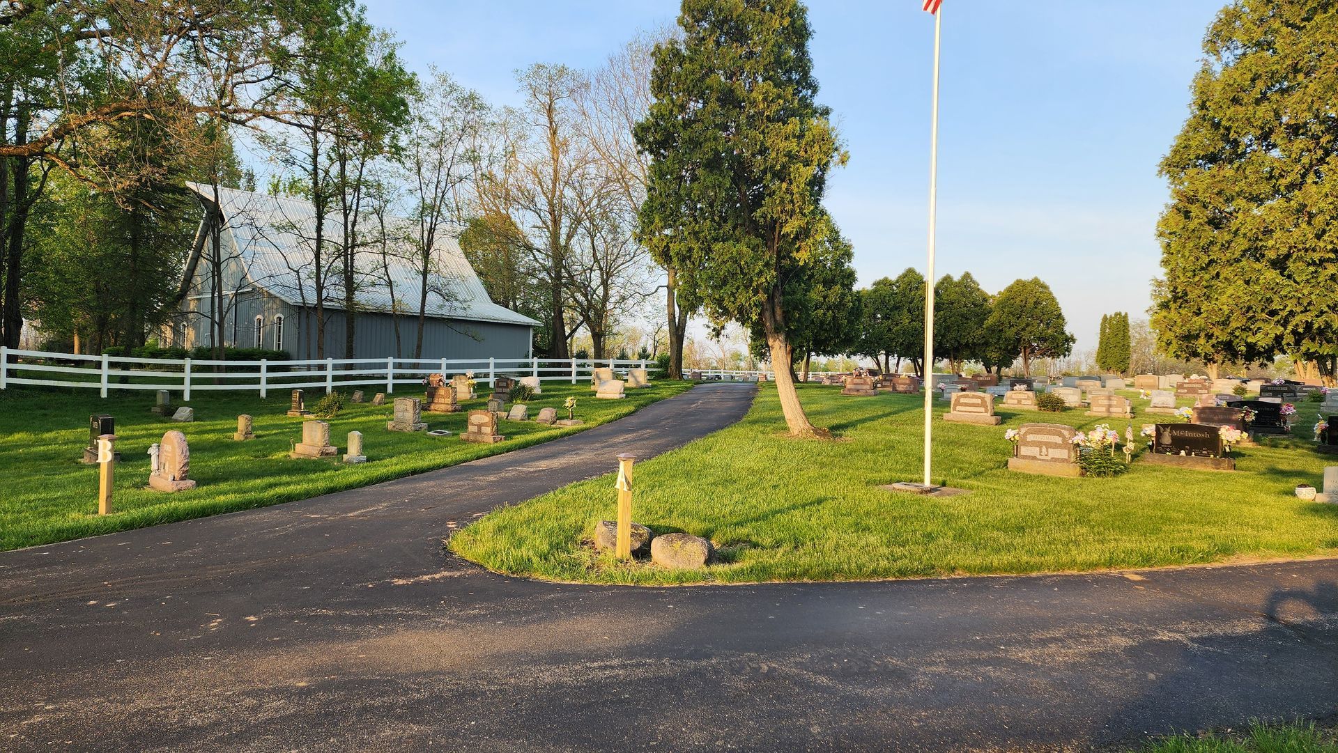 A graveyard with a road going through it