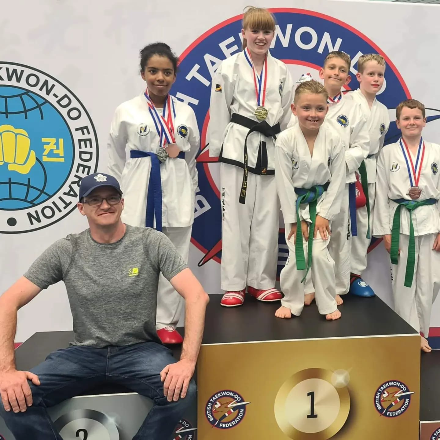 Nuneaton TKD medal winners on the podium at the BTF English Championships 2022