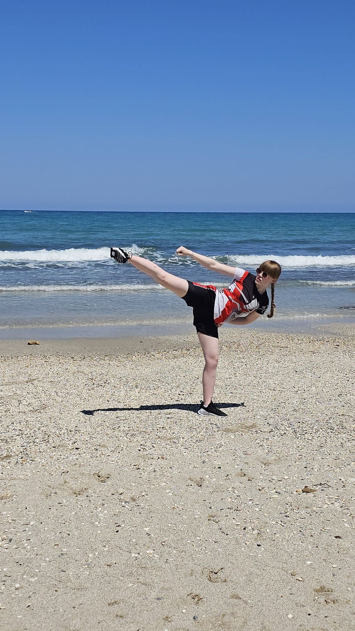 Ella Barnes side kick on the beach in Crete