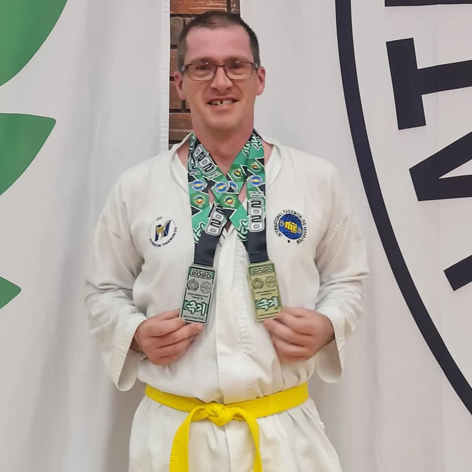 Nuneaton Taekwon-Do yellow belt Jock Burnside with medals