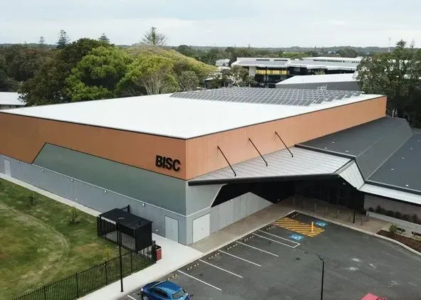 An aerial view of the BISC building, a tan and gray rectangular structure. An aerial view of the BISC building, a tan and gray rectangular structure.
