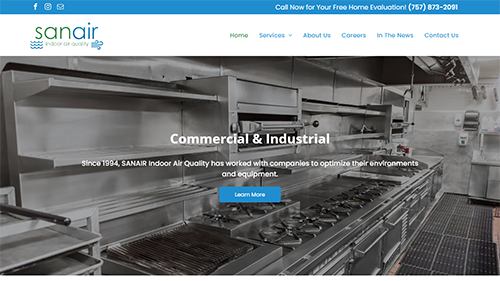 Commercial kitchen website homepage with a stainless-steel food processing line and menu bar