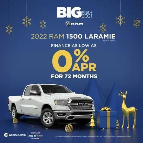 White 2022 Ram 1500 Laramie truck on blue holiday promo background, 0% APR for 72 months.