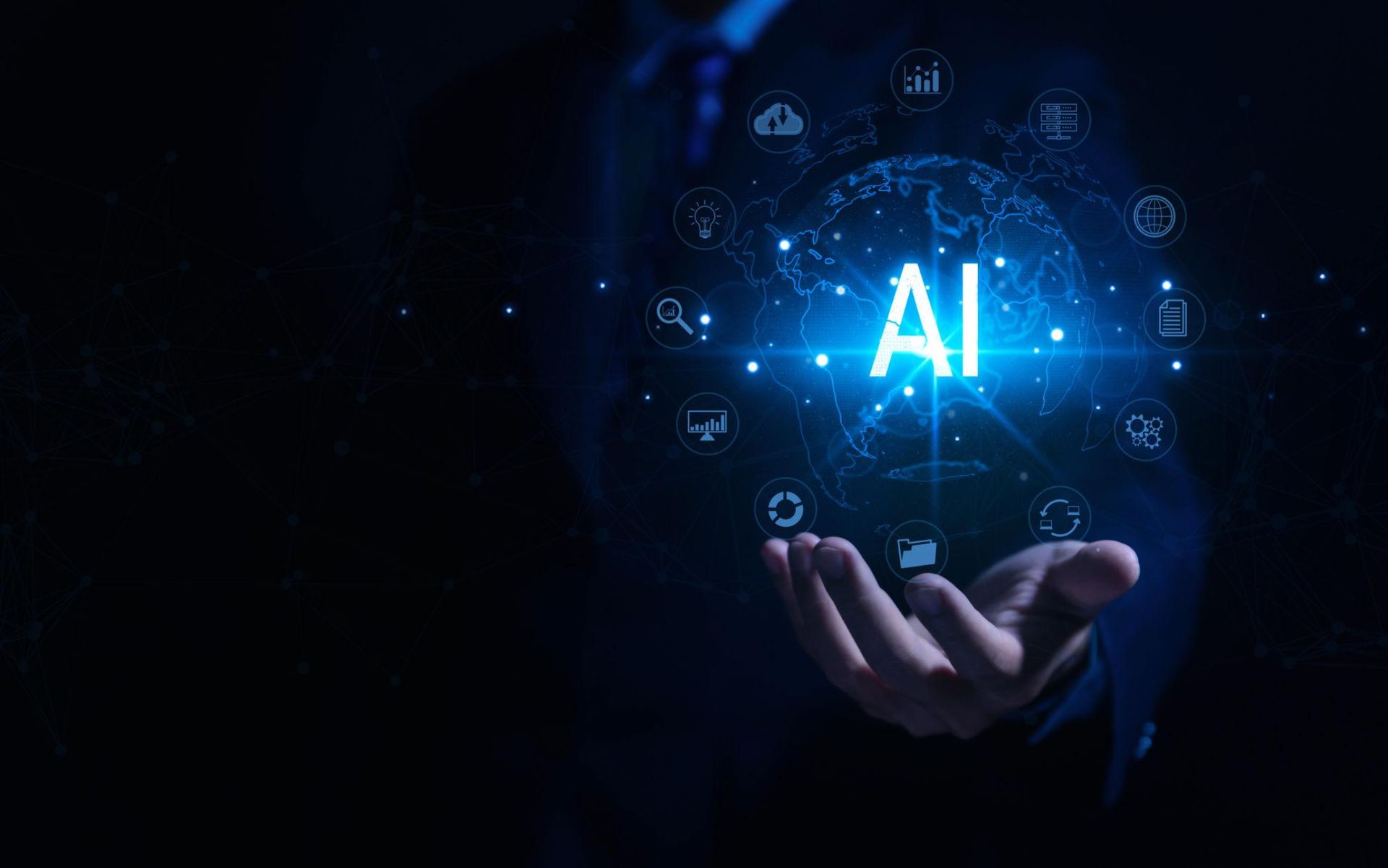 Glowing AI hologram above an outstretched hand on a dark background, with digital icons around it
