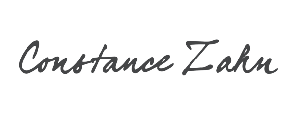O nome constance zahn está escrito em cursivo em um fundo branco.