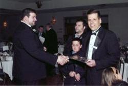 Patriots lineman Joe Audruzzi (Distinguished American Award) shakes hands with Branford coach Gary Gravina (04’ Coach of the Year)