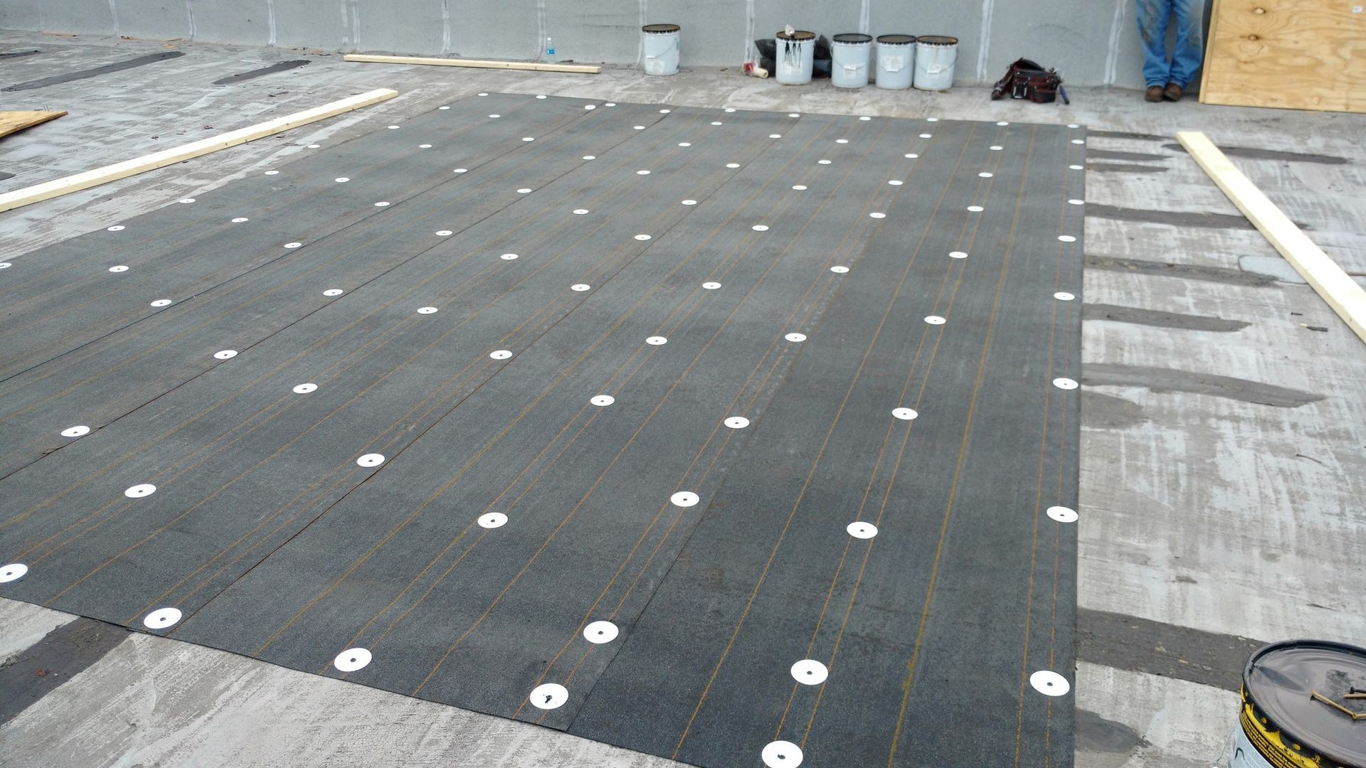 A black carpet with white dots on it