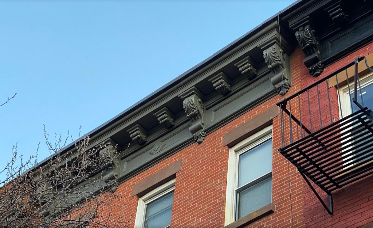 A brick building with a fire escape on the side