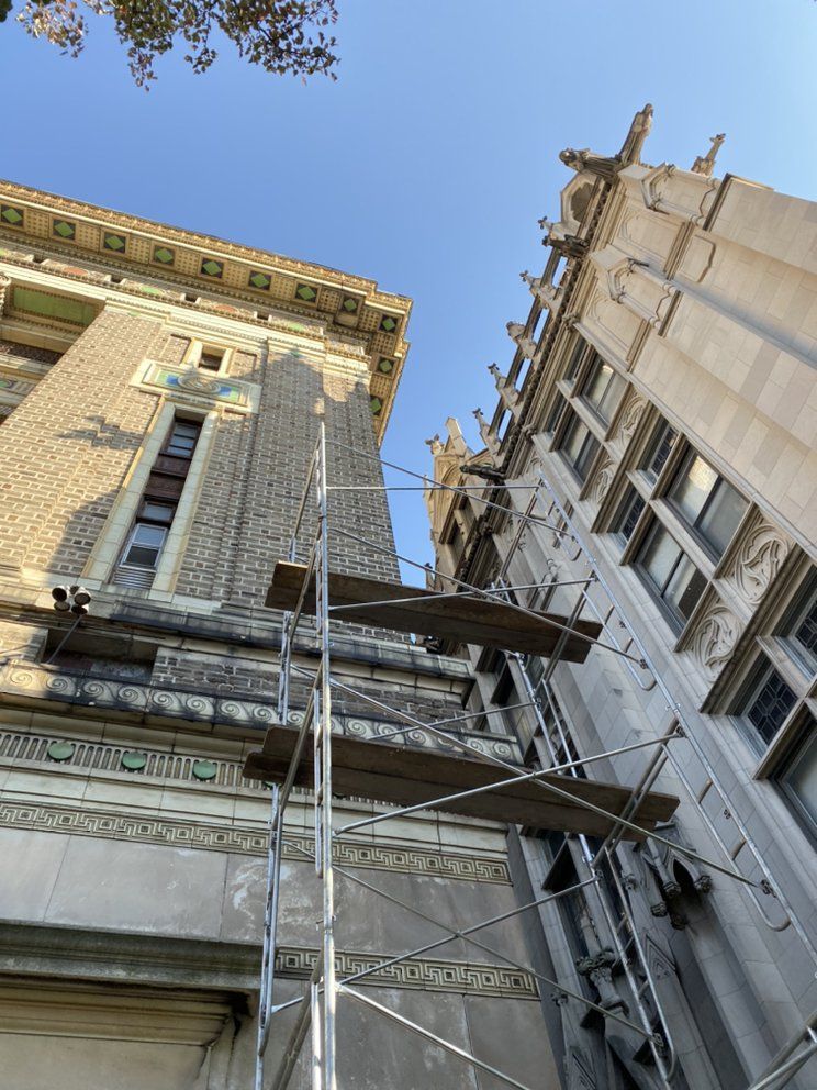 A large building with scaffolding on the side of it.