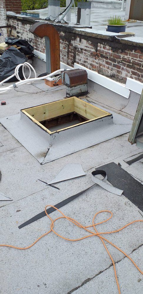 A skylight is being installed on the roof of a building.