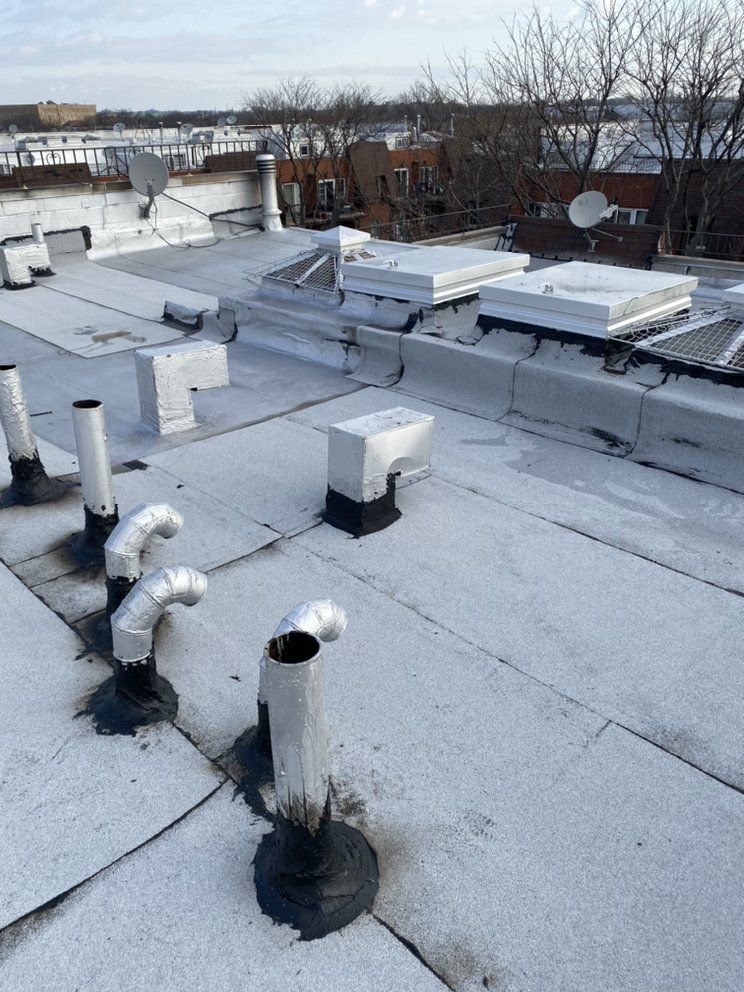 A roof with a lot of pipes on it