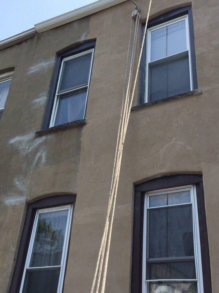 A building with a rope attached to the side of it