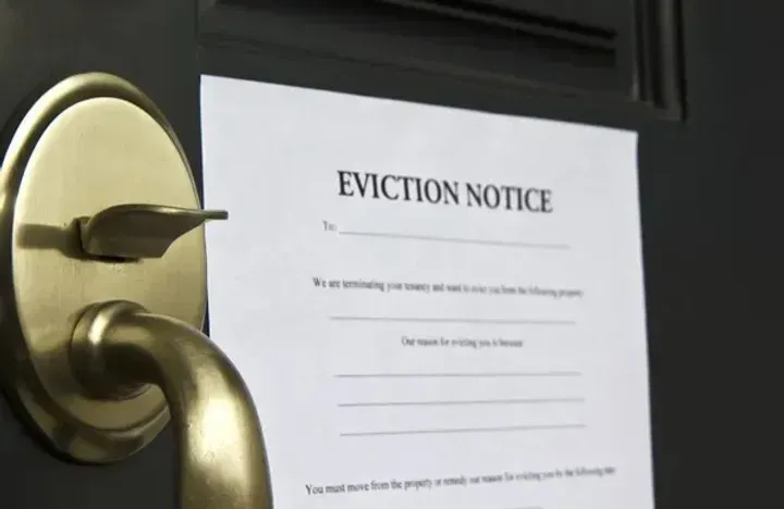 A door with an eviction notice on it