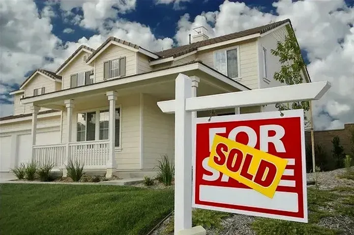 Sold sign in front of home