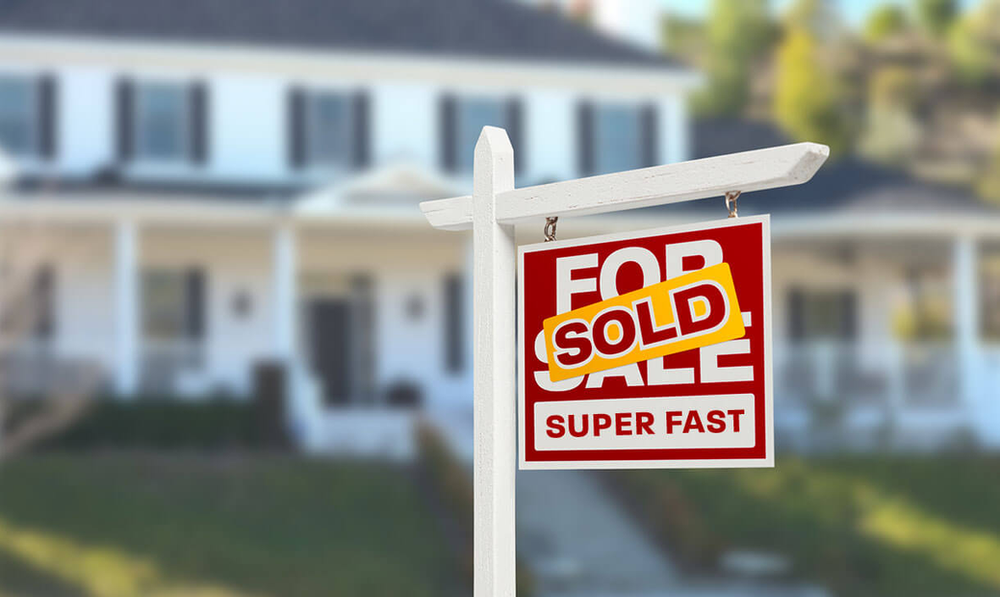 Sold sign in front yard
