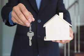 Person hading over keys